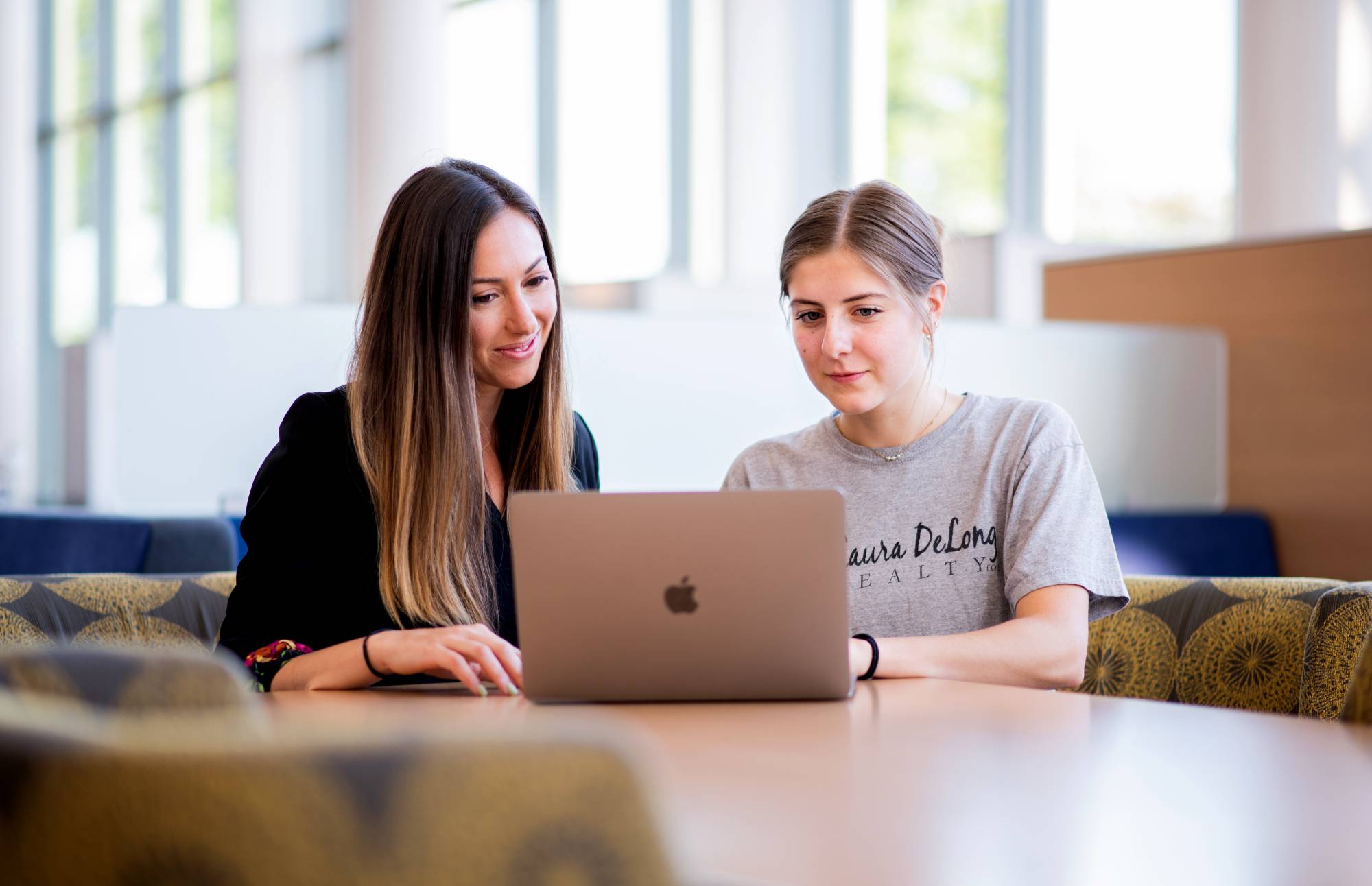 Dr. Singer with student at a computer
